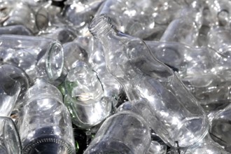 Bottle glass in a recycle bin mound