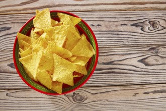 Nachos mexican food tortilla on red white wood background