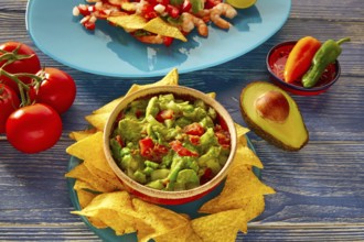 Guacamole with avocado tomatoes and nachos mexican food