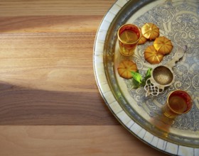 Green tea with mint Moroccan style on silver tray and biscuits