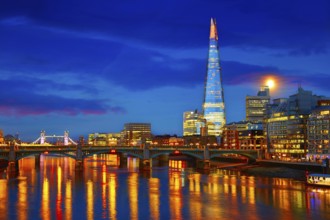 London skyline sunset on Thames river reflection at UK