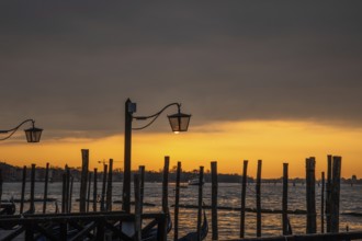 Morning atmosphere at sunrise, gondola jetty, lanterns, Venice, Italy, Europe