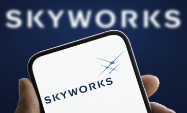 skyworks logo is displayed on smartphone. Skyworks Solutions Inc is an American semiconductor