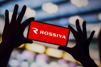 In this photo illustration, the Rossiya Airlines logo is displayed on a smartphone screen
