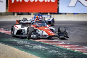 LUCA GHIOTTO (R) (51) of Arzignano, Italy practices for the Firestone Grand Prix of Monterey at