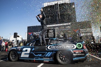Austin Cindric celebrates after winning the Enjoy Illinois 300 at the World Wide Technology Raceway