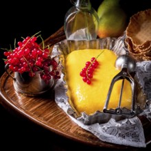 Homemade mango ice cream with currant