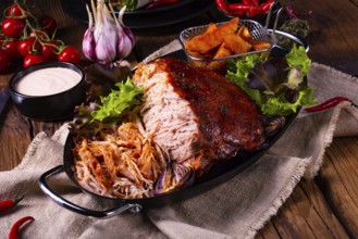 Delicious pulled pork with jacket potato quarters
