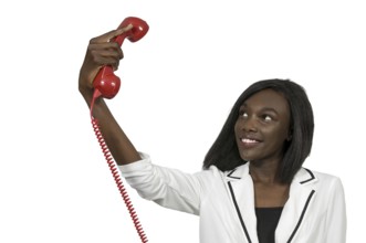 Beautiful woman trying to take a selfie with a rotaryl phone