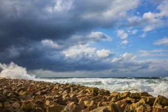 New Quay in the Old Jaffa in a winter storm. Huge foaming waves of the Mediterranean beat against