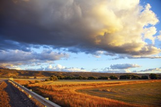 The endless Argentinean prairie and the famous Ruta 40 dirt road. A gigantic scenic thundercloud