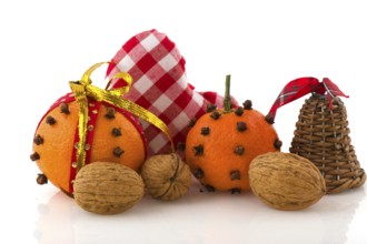 Christmas still life with orange cloves and walnuts