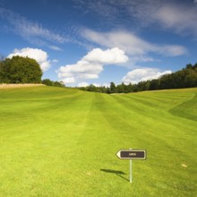 Empty golf fairway in sunny day
