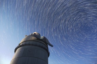 Astronomical observatory under the night sky stars. Blue sky with hundreds of stars of the Milky