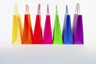 Set of colorful empty shopping bags isolated on the white background. Sale, consumerism,