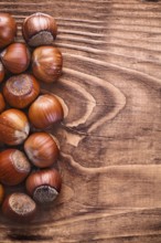 Hazelnuts on vintage wooden board food and drink concept