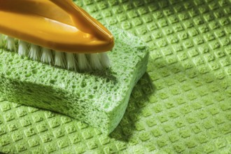 New plastic brush kitchen sponge on dishcloth
