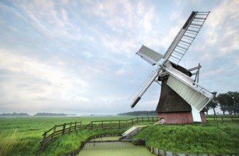 Dutch windmill during cloudy summer morning, Netherlands