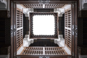 View up in a small patio of a traditional oriental Moroccan building