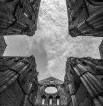 Missing ceiling opening the view to the sky in the destroyed abandoned Cistercian monastery San