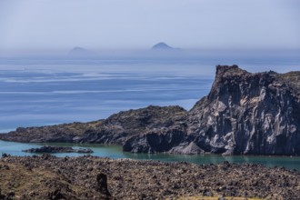 View from the volcanic island of Nea Kameni to the volcanic island of Palea Kameni, Archipelago of
