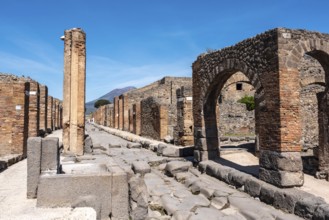 POMPEII, ITALY, MAY 04, 2022, A crosswalk of a typical Roman road in the ancient city of Pompeii,