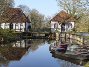 Traditional architecture and boats are reflected in the calm waters, winterswijk, gelderland, the