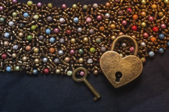 Heart shaped lock and key on an abstract background