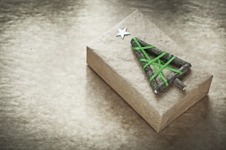 Christmas handmade gift box on vintage paper