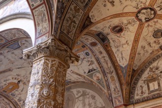 Wall frescoes of rich decorated courtyard of Palazzo Vecchio in Florence, Italy, Europe