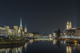 Limmat river with view of churchs in Zurich in evening, Switzerland, Europe