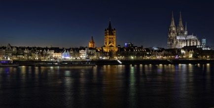 Cityscape of Cologne with old town and cathedral at night