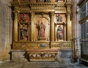Segovia, Spain, 7 April, 2024: detail view of a gilded altar piece in a side chapel of the Segovia