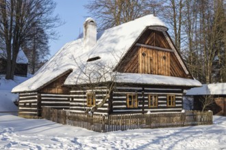 Traditional wooden timbered cottage in winter. Folk museum in Vesely Kopec, Czech Republic, Europe