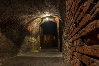Medieval Passage to the old Castelvecchio Bridge over the Adige River at Night, Verona, Italy,