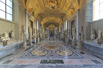 Inside of the Vaticans museums in one of the long hallways with few visitors