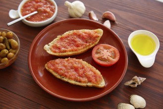 Bread toasted slices with grated tomato Catalonia style pan tomaquet