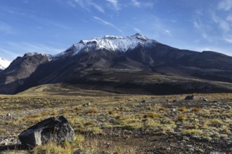 Beautiful volcanic landscape of Kamchatka Region: autumn view of Kozelsky Volcano on background of