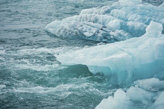 Blue icebergs floating in a cold, tranquil ocean scene, iceberg, glacier, snow, ice rock, ice