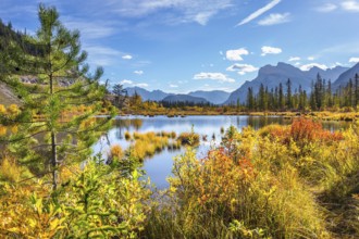 The Rocky Mountains of Canada. The magic of northern Indian summer. Lake Vermillon among yellow