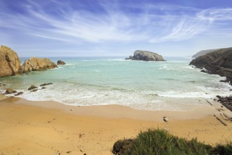 Playa de la Arnia beach. Amazing geological formations amaze tourists. Sea waves break on the