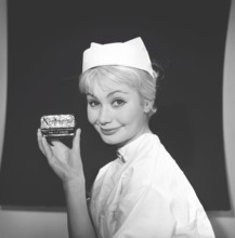 Beauty care in the 1950s. A young woman is holding a package of soap named Neutrogena. Sweden 1959.