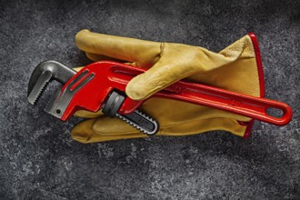 Monkey Wrench On Yellow Working Gloves