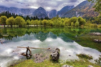 The lake shores are flooded. Picturesque shallow lake Fuzine of glacial origin. The mountains are