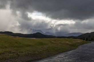 Spean River with bad weather front, Highlands, Scotland, Great Britain