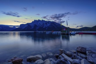 Beautiful autumn landscape scene in lake and mountain in background in west Canada, colour kayaks