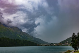 Panoramic View over City and Lake Sankt Moritz and Mountain Valley with Beautiful Storm Clouds in a