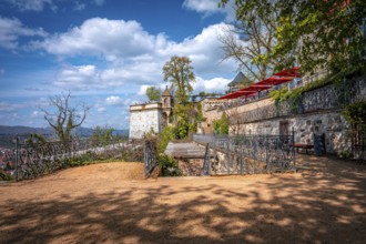 Quiet area next to a castle wall with a view of the countryside under a sunny sky, Wernigerode,