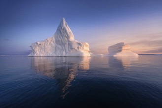 Floating glaciers in the rays of the setting sun at polar night