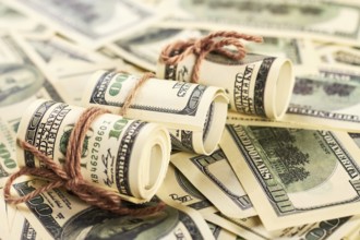 American dollars in rolls. Saving money for charity